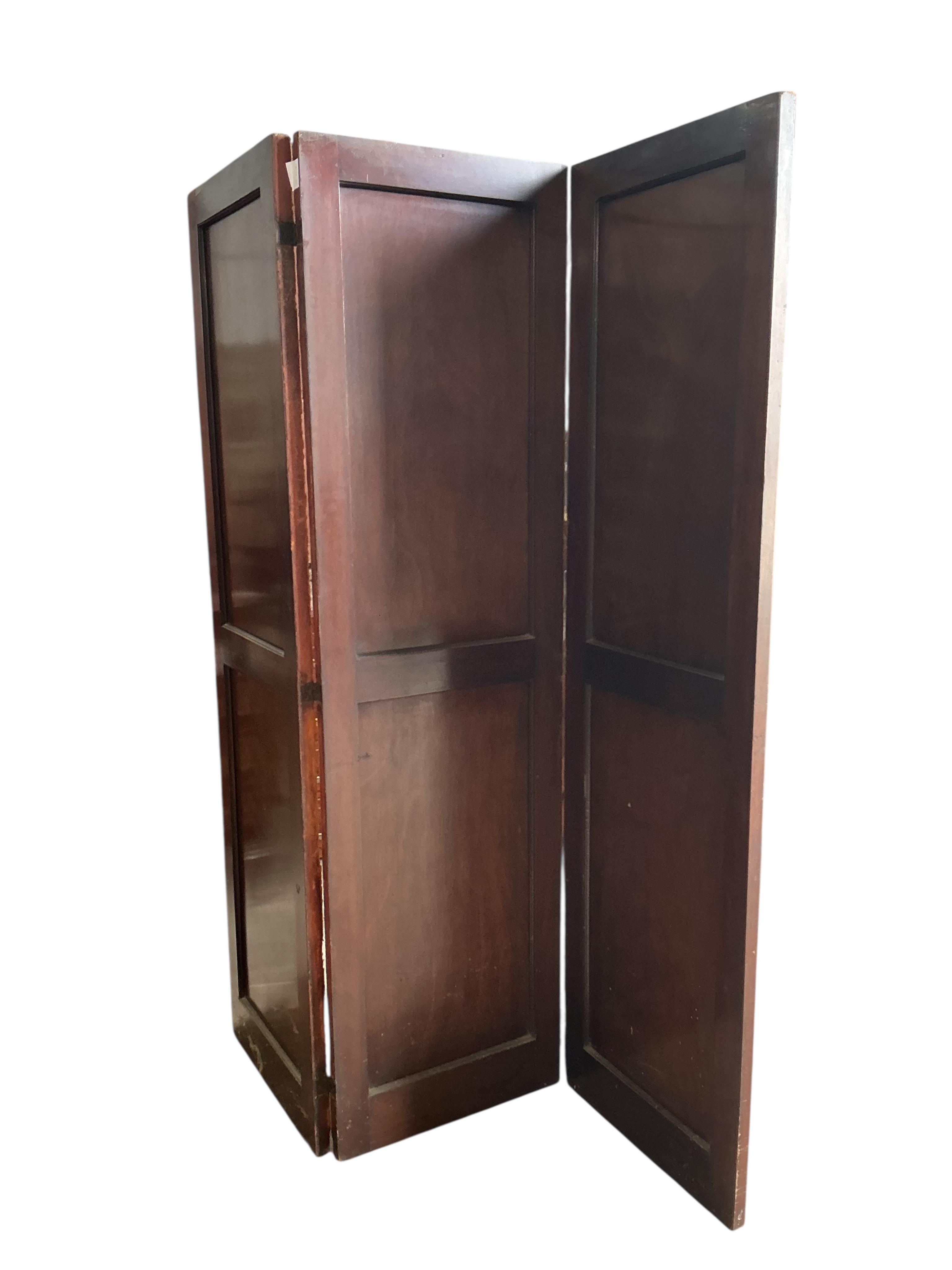 A painted leather and mahogany three fold dressing screen, each panel width 48cm, height 174cm